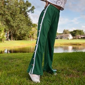 Green button breakaway track pants